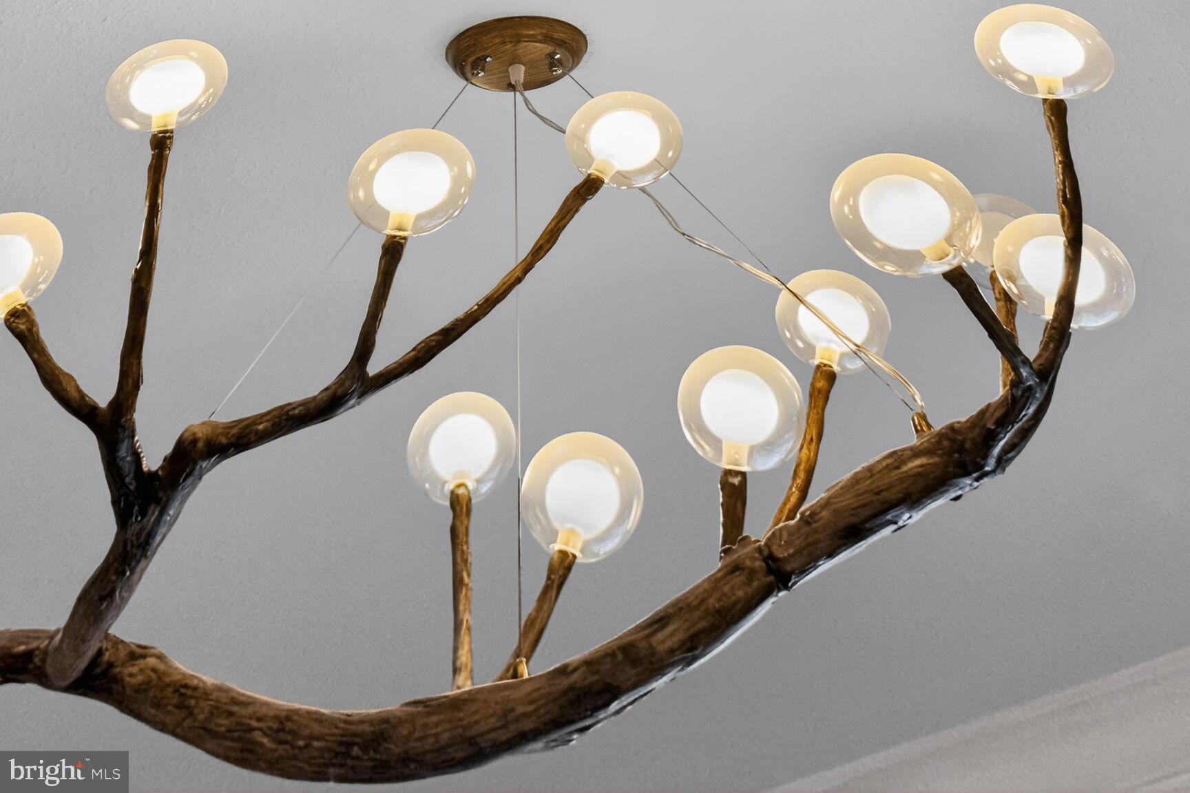 1601 Spring Gate Dr., Unit 1411 McLean, VA 22102 - Photo 15 of 39 a view of a chandelier fan and a mirror