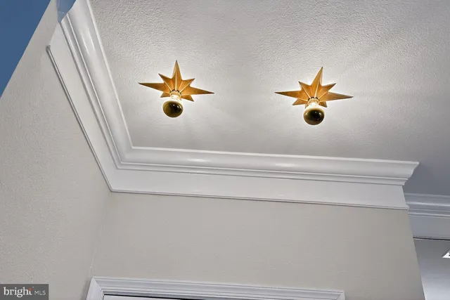 a view of a hallway with a ceiling fan