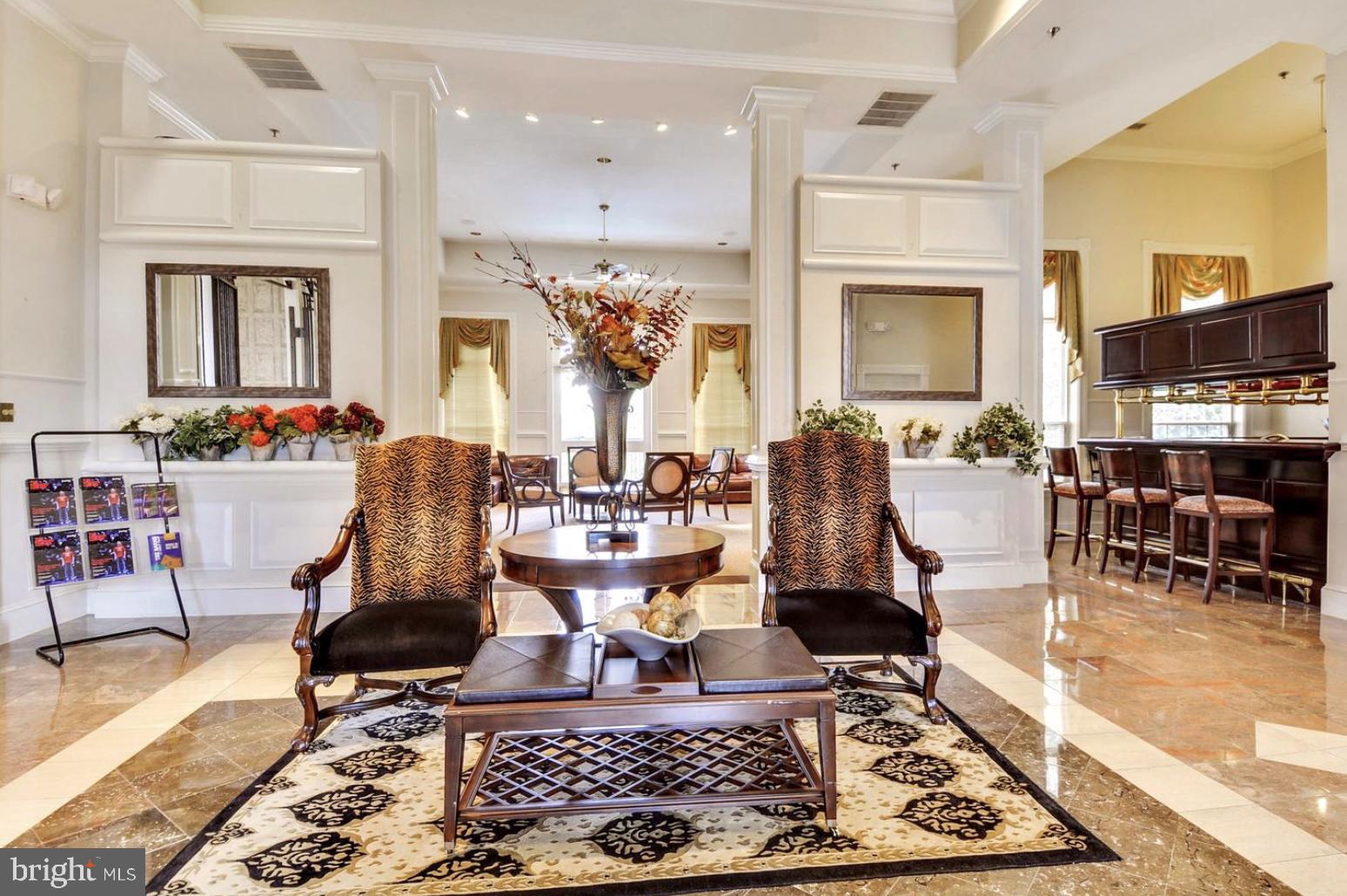 1601 Spring Gate Dr., Unit 1411 McLean, VA 22102 - Photo 25 of 39 a living room with fireplace furniture and a rug