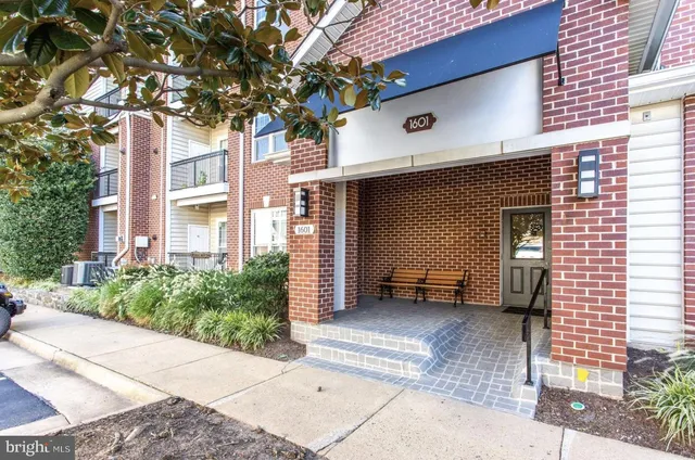 a view of a swimming pool with sitting area
