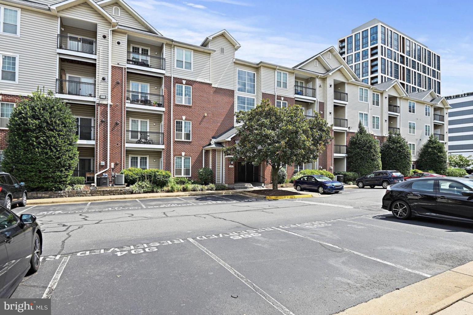 1601 Spring Gate Dr., Unit 1411 McLean, VA 22102 - Photo 28 of 39 a view of a parked cars in front of a building