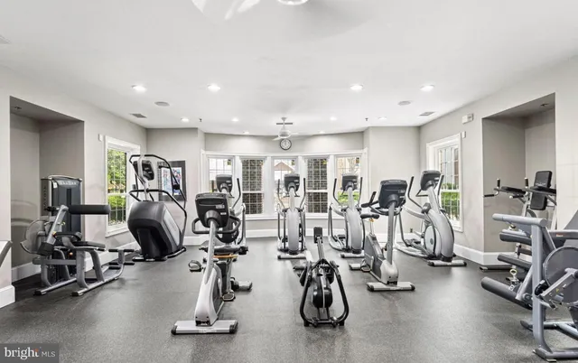 a bathroom with a granite countertop double vanity sink and a mirror
