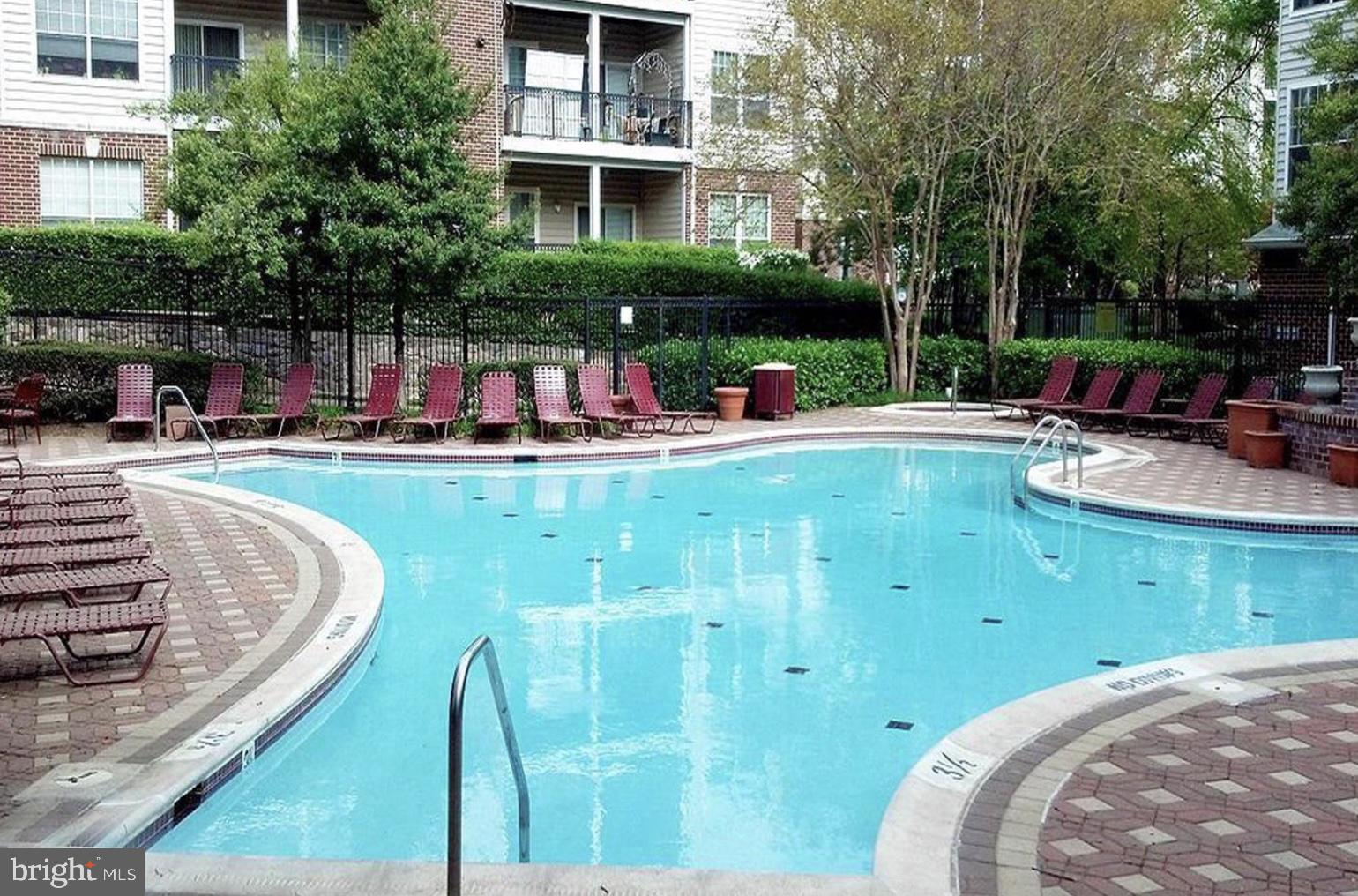 1601 Spring Gate Dr., Unit 1411 McLean, VA 22102 - Photo 35 of 39 a view of a swimming pool with a patio