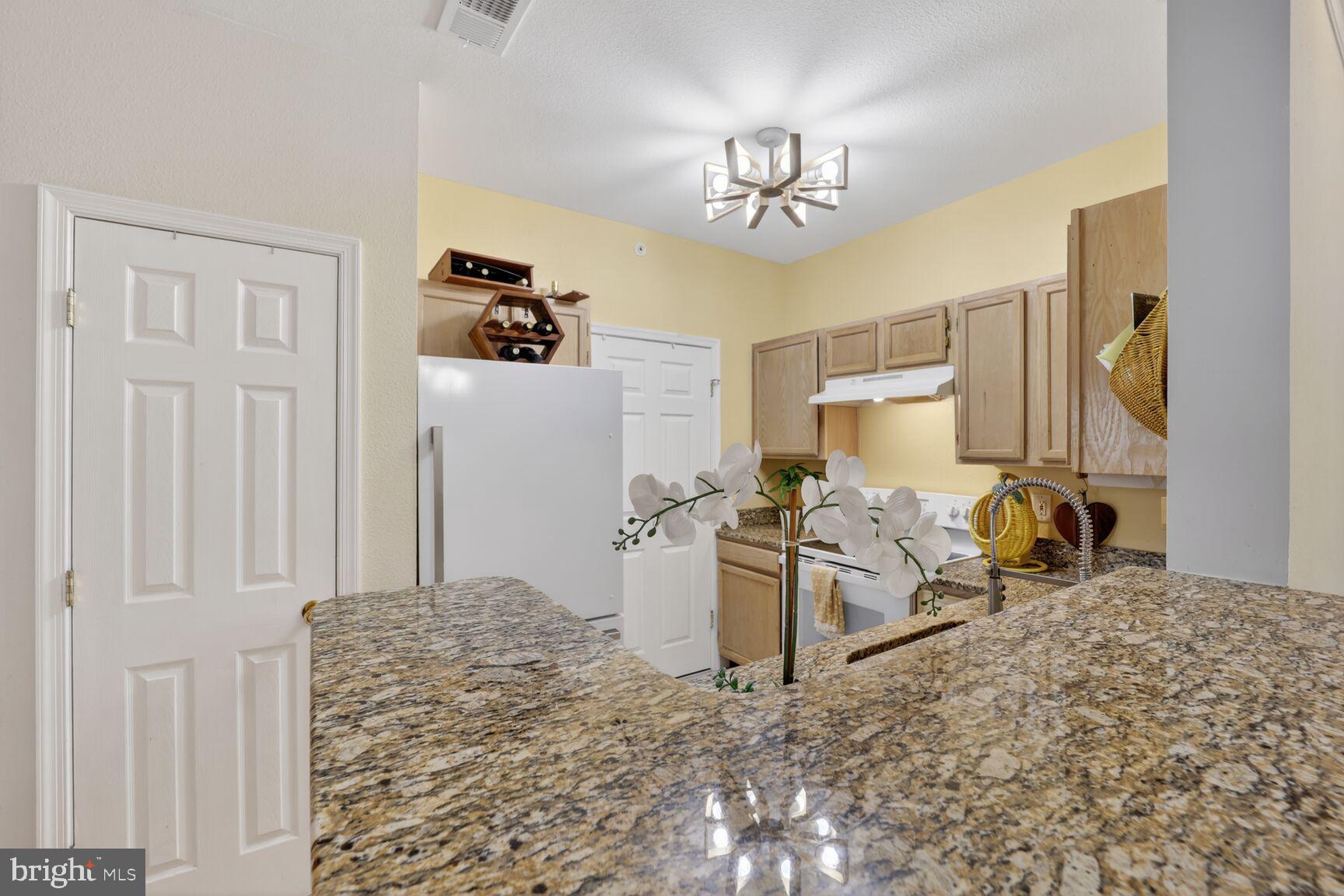 1601 Spring Gate Dr., Unit 1411 McLean, VA 22102 - Photo 4 of 39 a view of a livingroom with furniture and chandelier