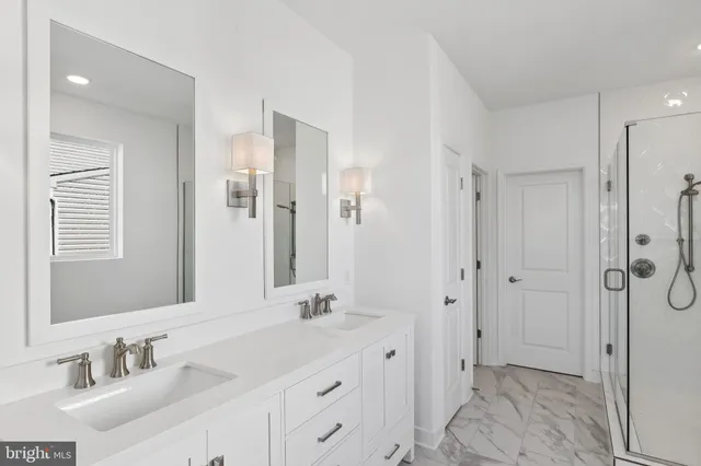 a bathroom with a double vanity sink mirror and double