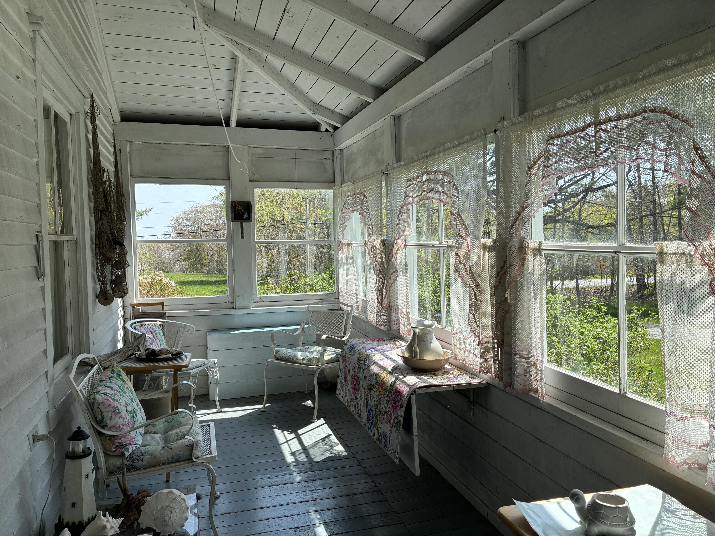 707 Newbury Neck Road Surry, ME 04684 - Photo 15 of 40 Glassed in porch off living room.
