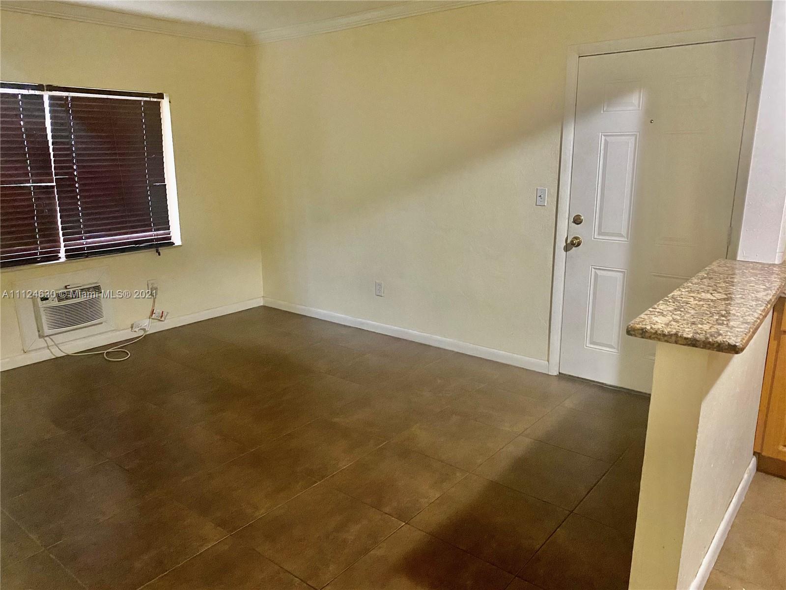 520 Northeast 82nd Terrace, Unit 7 Miami, FL 33138 - Photo 11 of 11 a view of hallway with washer and dryer