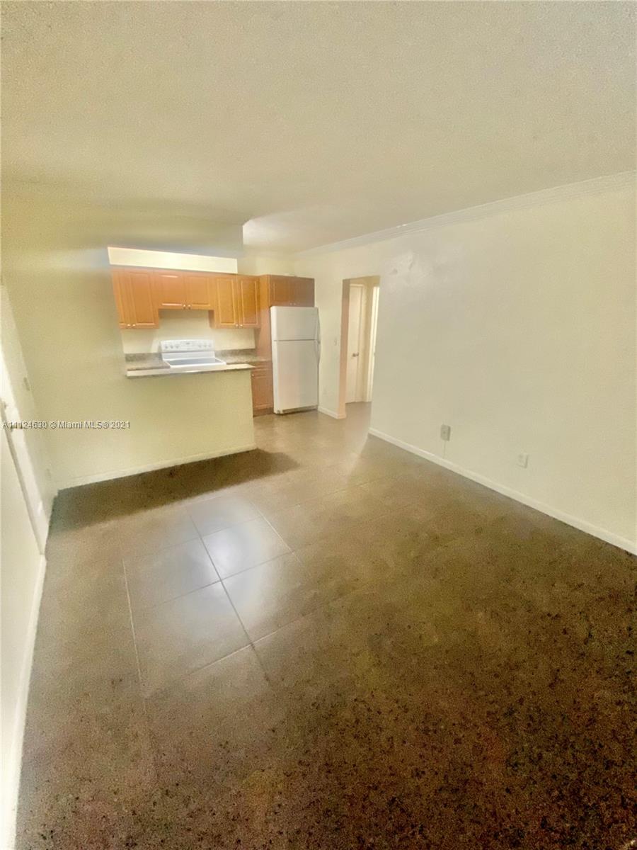 520 Northeast 82nd Terrace, Unit 7 Miami, FL 33138 - Photo 4 of 11 a view of an empty room with a window