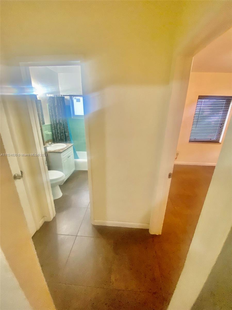 520 Northeast 82nd Terrace, Unit 7 Miami, FL 33138 - Photo 6 of 11 a bathroom with a sink and a toilet