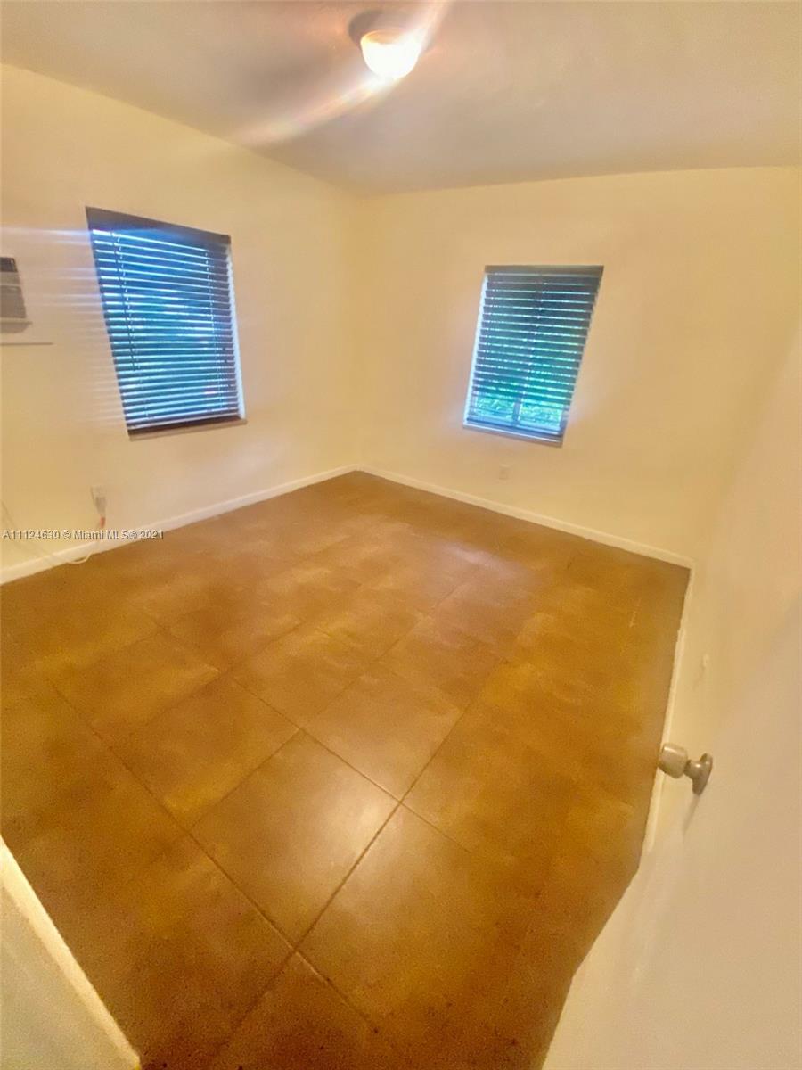 520 Northeast 82nd Terrace, Unit 7 Miami, FL 33138 - Photo 8 of 11 a view of a wall with an empty room