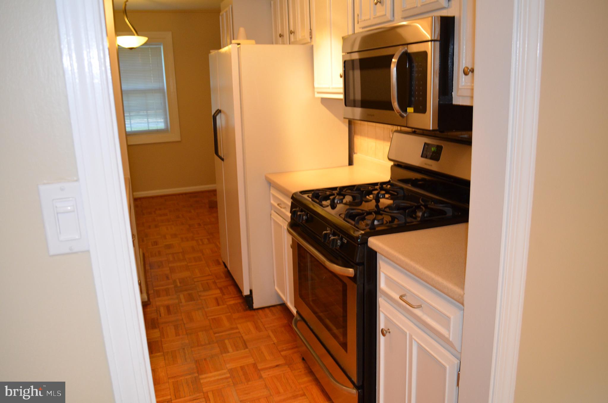 8902 16th Street Silver Spring, MD 20910 - Photo 6 of 70 Galley kitchen w/ Frigidaire stainless steel app