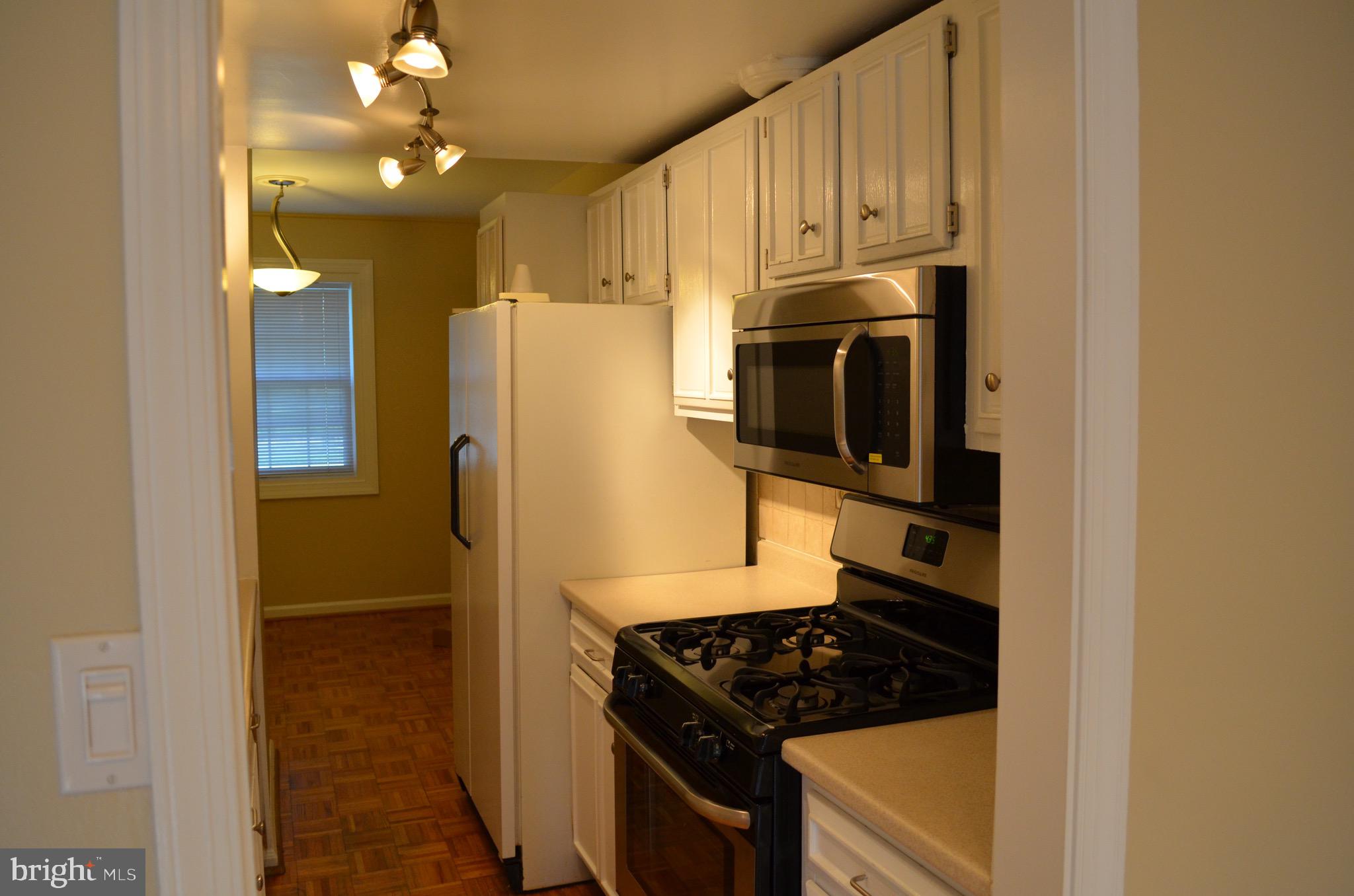 8902 16th Street Silver Spring, MD 20910 - Photo 7 of 70 Galley kitchen w/ Frigidaire stainless steel app
