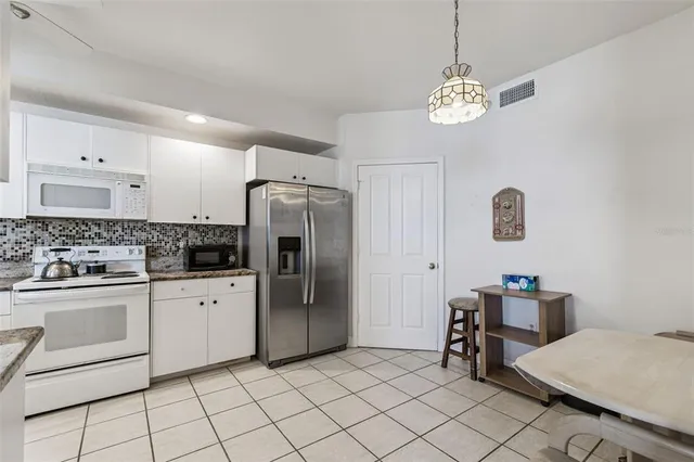 $830,000 | 4991 Bacopa Lane South, Unit 502, St. Petersburg, FL 33715