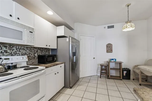 $830,000 | 4991 Bacopa Lane South, Unit 502, St. Petersburg, FL 33715