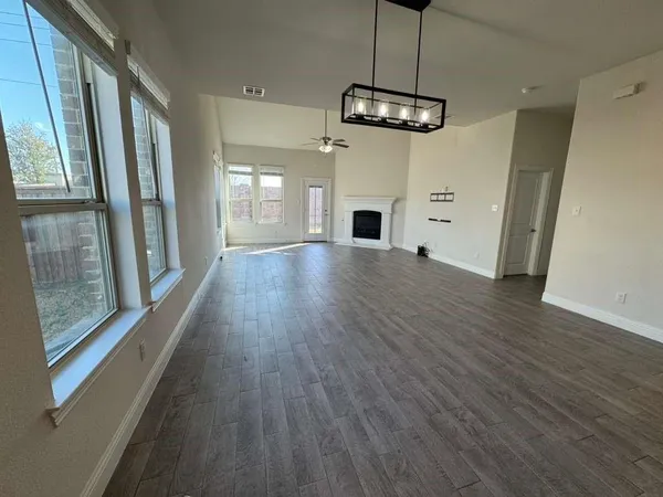 a view of a livingroom with furniture and a fireplace