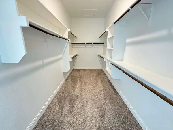 a kitchen with stainless steel appliances a refrigerator and a window