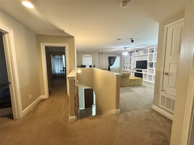 a bedroom with a bed dresser and a window