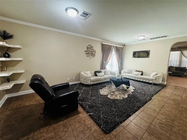 a living room with furniture and rug