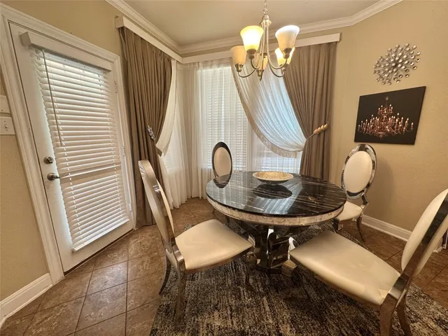 a view of a room with furniture and wooden floor