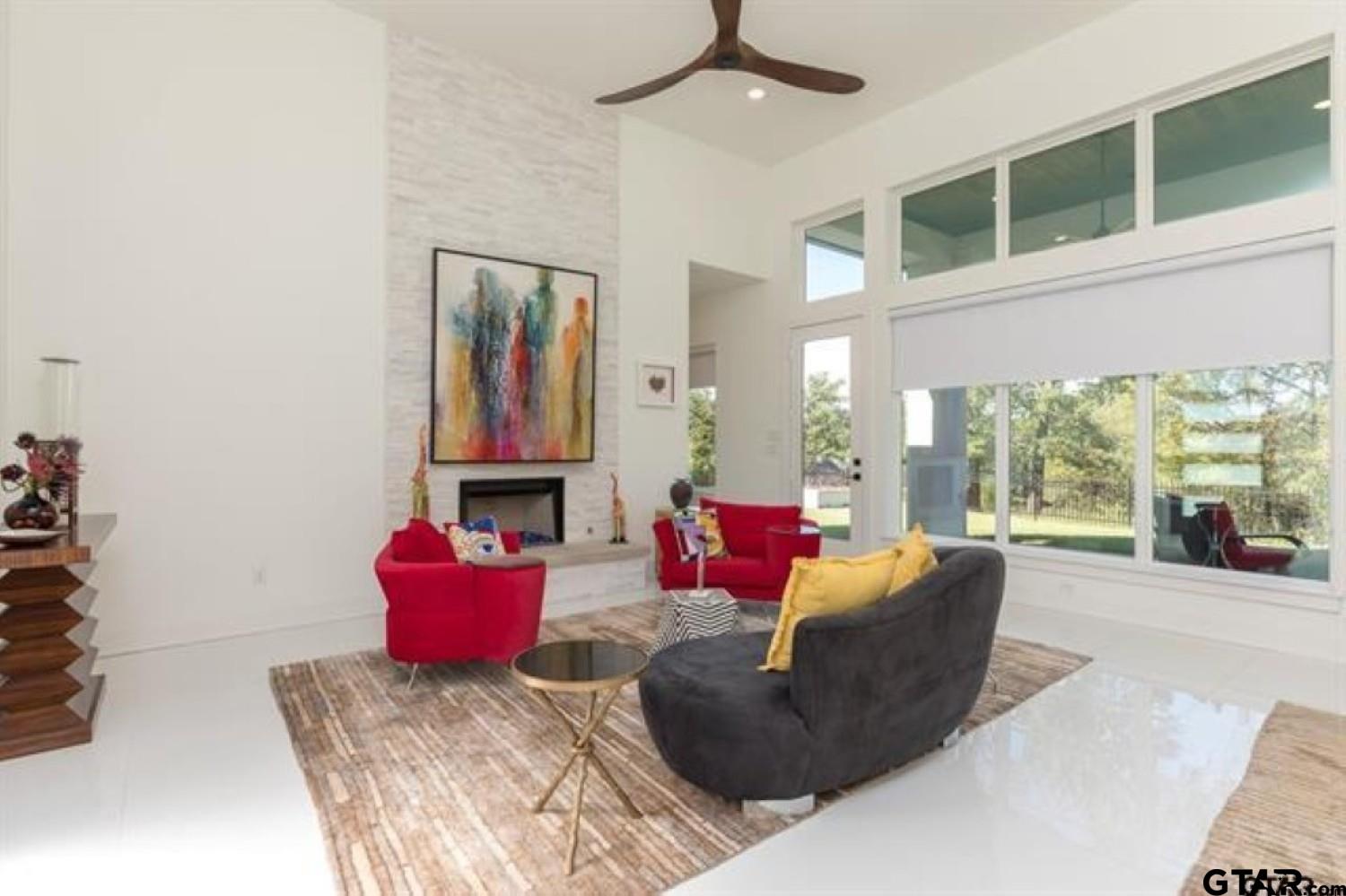 2854 J J.Cupit Court Tyler, TX 75709 - Photo 15 of 48 a living room with furniture and a floor to ceiling window