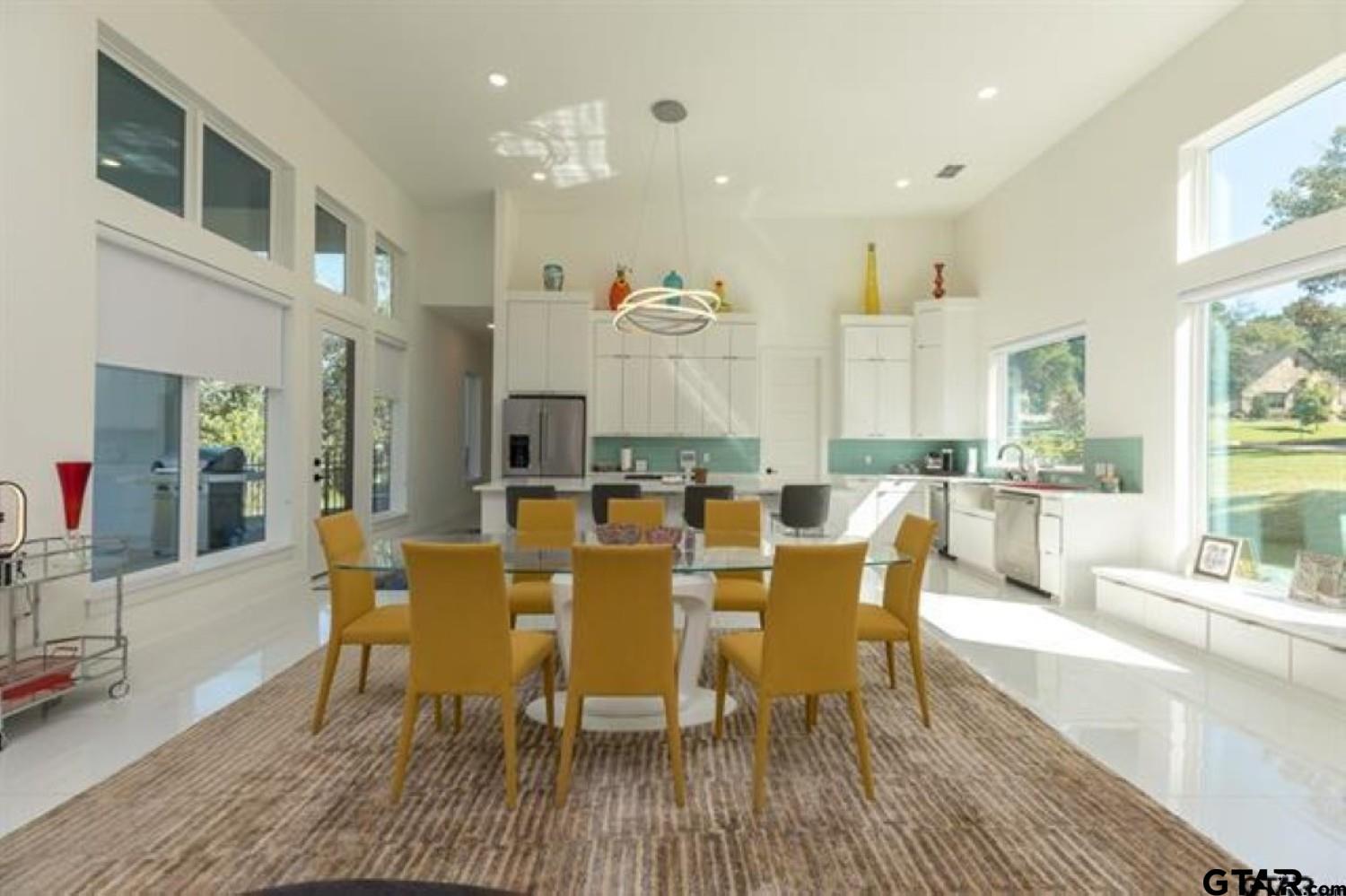 2854 J J.Cupit Court Tyler, TX 75709 - Photo 18 of 48 a large kitchen with a dining table wooden floor and a large window