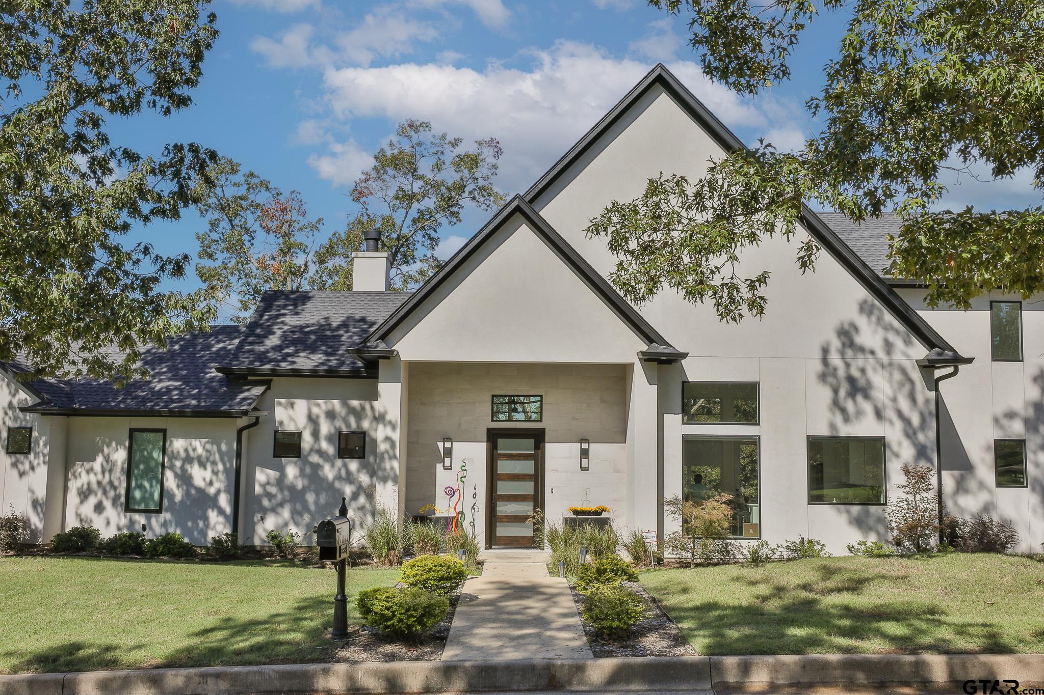 2854 J J.Cupit Court Tyler, TX 75709 - Photo 2 of 48 a front view of a house with garden