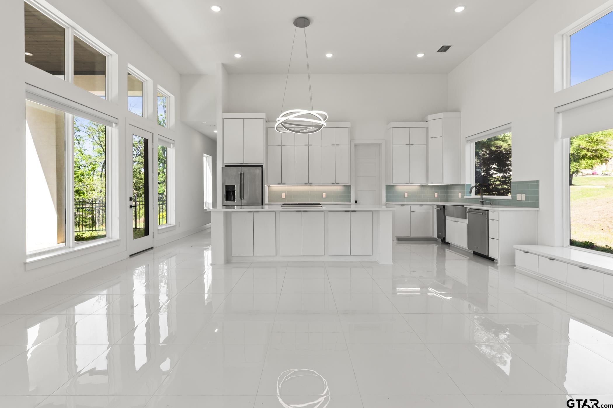 2854 J J.Cupit Court Tyler, TX 75709 - Photo 23 of 48 a kitchen with stainless steel appliances granite countertop a stove a sink and a refrigerator