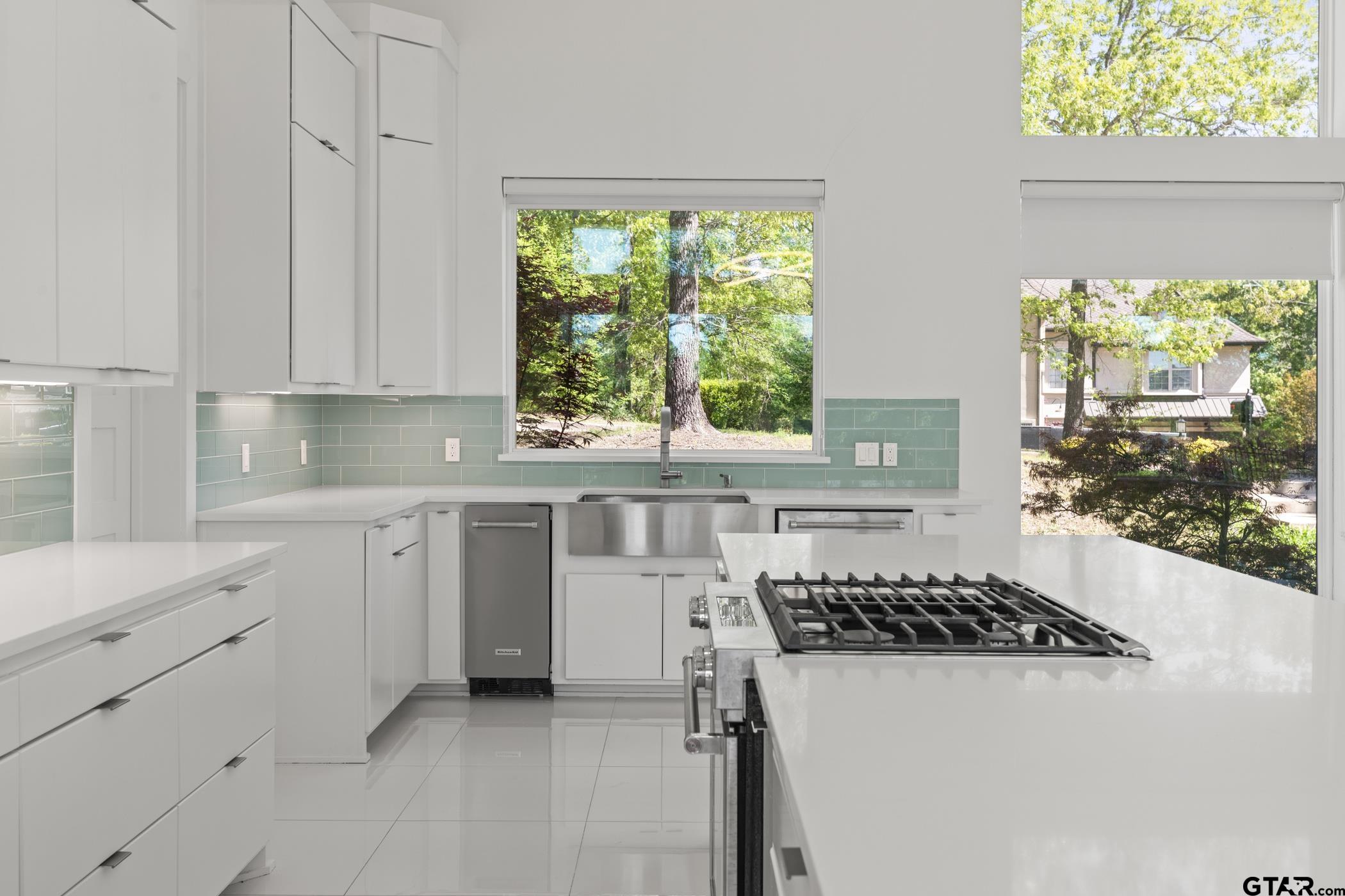 2854 J J.Cupit Court Tyler, TX 75709 - Photo 25 of 48 a kitchen with a window a sink and a stove