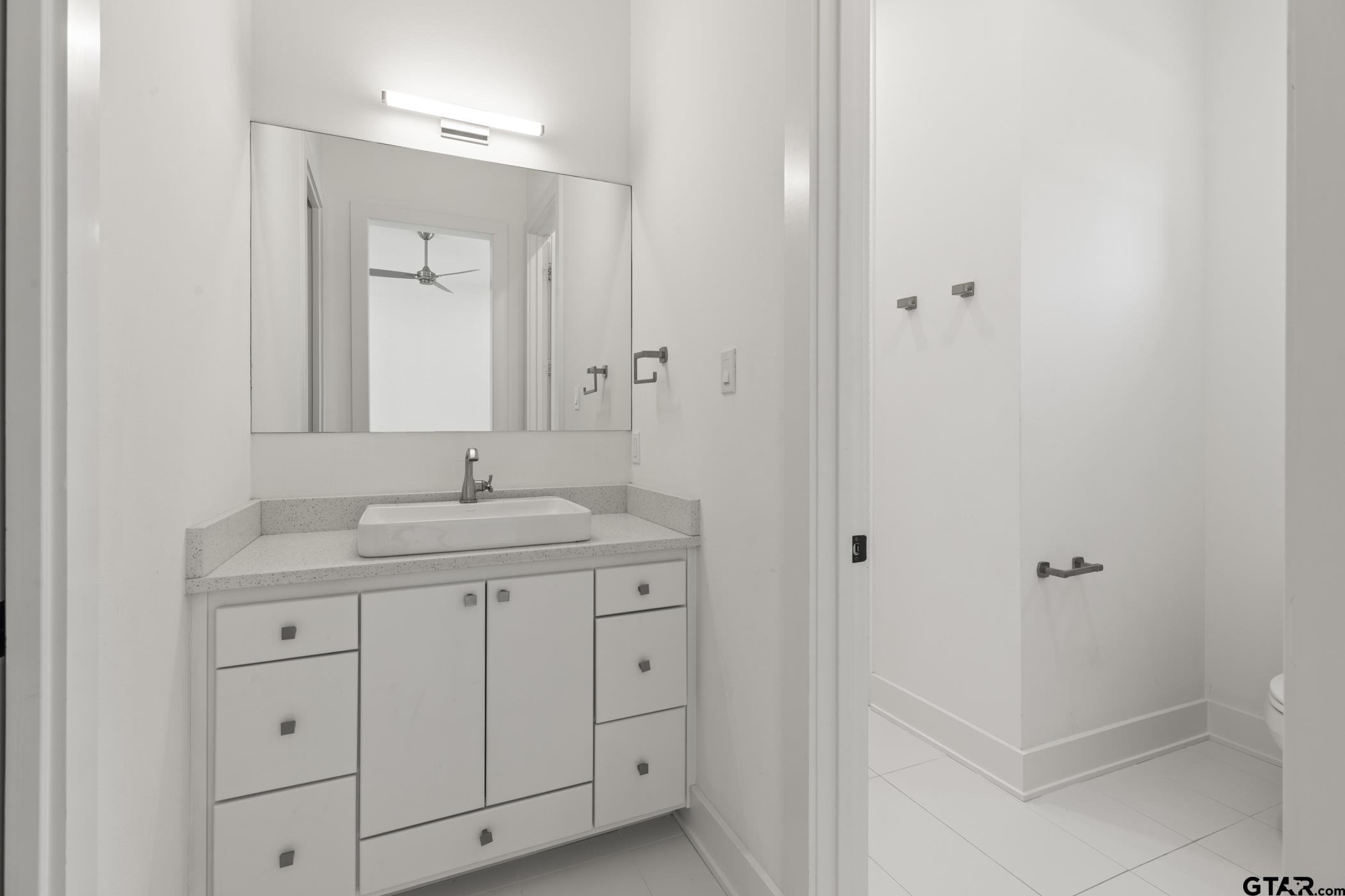 2854 J J.Cupit Court Tyler, TX 75709 - Photo 34 of 48 a bathroom with a toilet sink and mirror