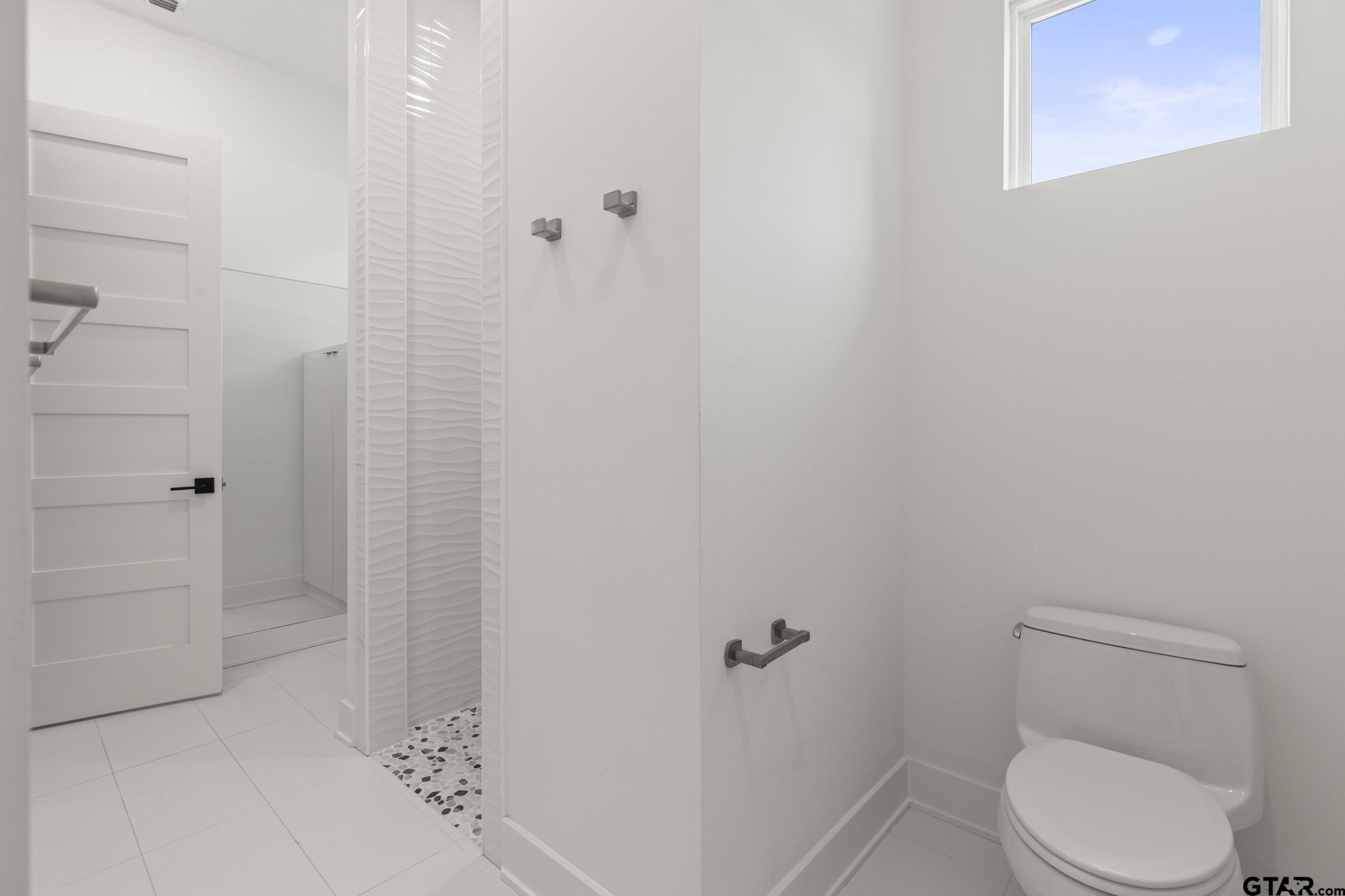 2854 J J.Cupit Court Tyler, TX 75709 - Photo 35 of 48 a white toilet sitting next to a shower