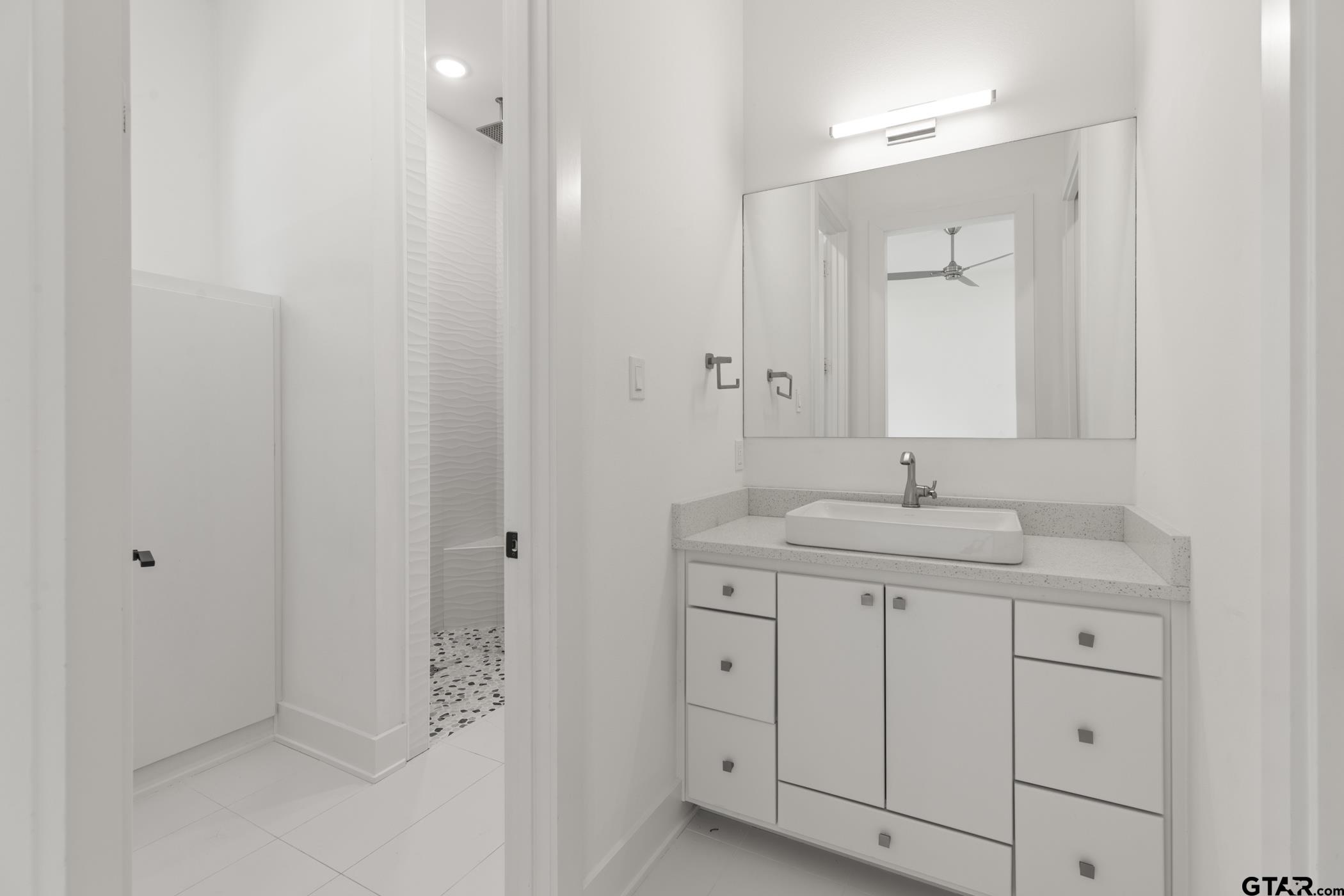 2854 J J.Cupit Court Tyler, TX 75709 - Photo 37 of 48 a bathroom with a sink and a mirror