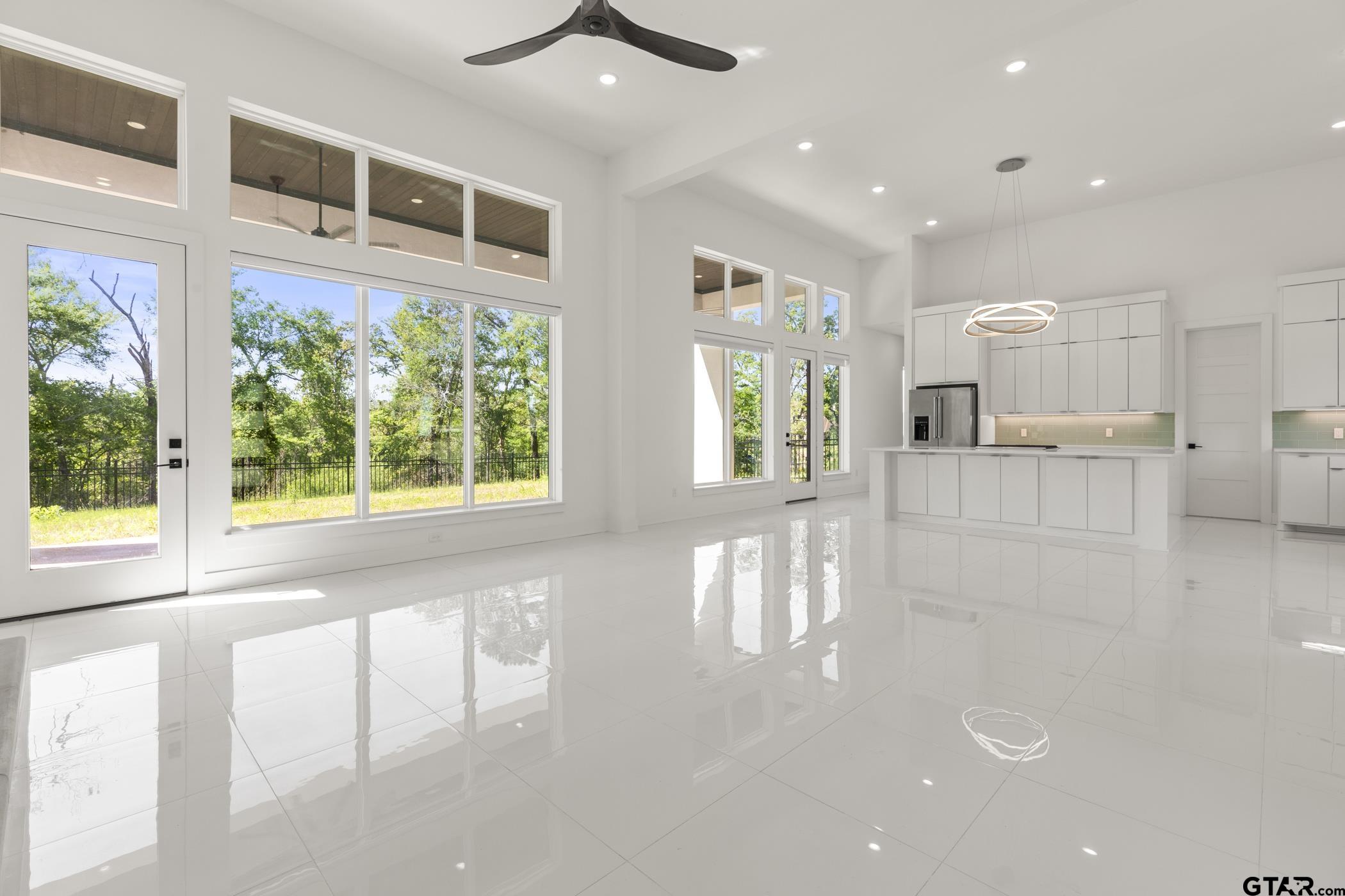 2854 J J.Cupit Court Tyler, TX 75709 - Photo 40 of 48 a open kitchen with white cabinets and a large window