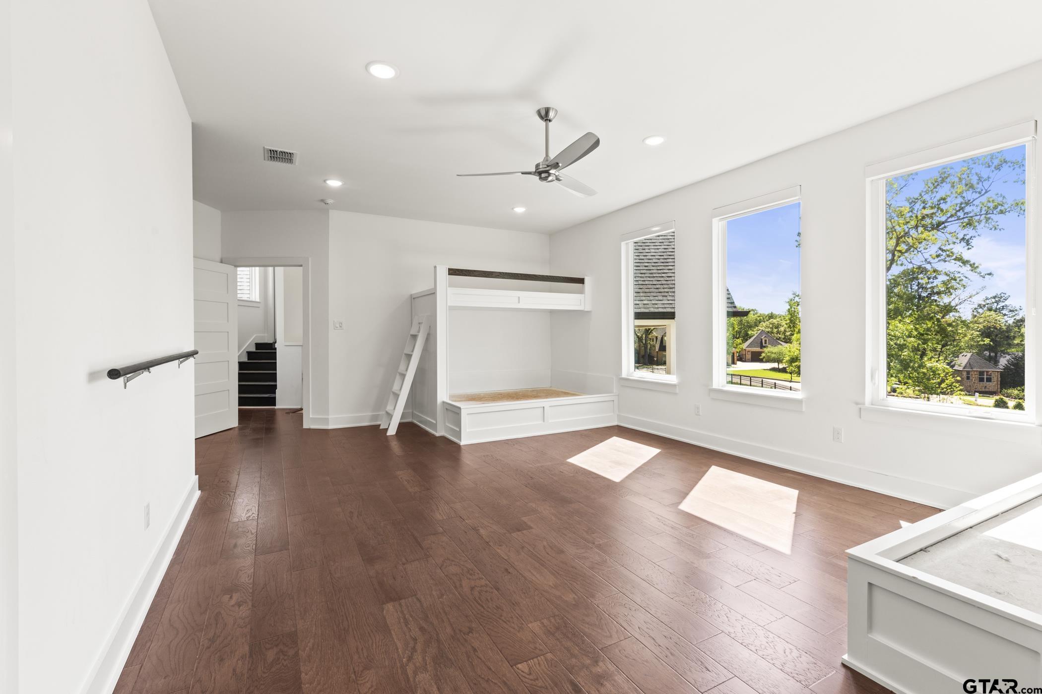 2854 J J.Cupit Court Tyler, TX 75709 - Photo 43 of 48 a view of an empty room with wooden floor and a window