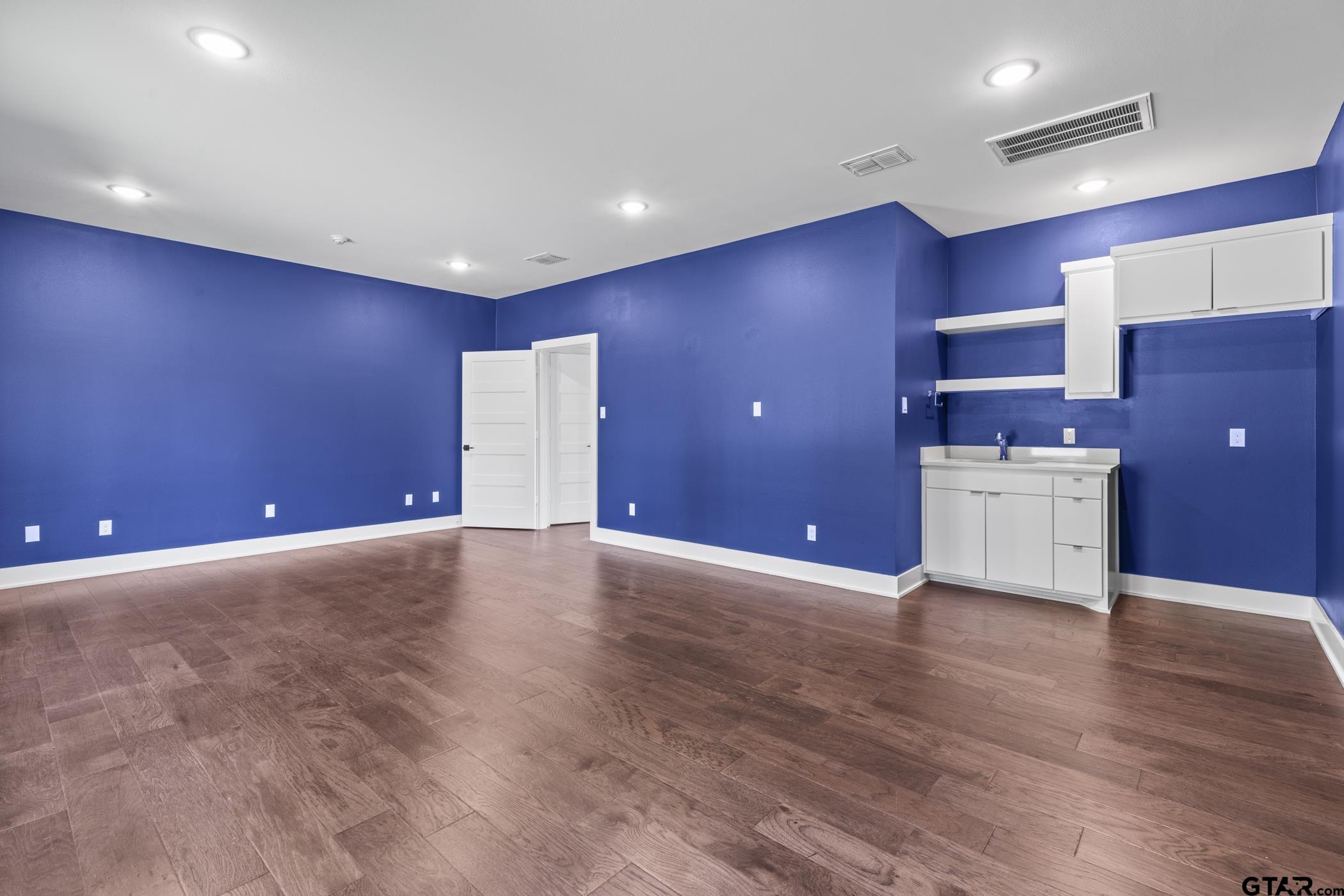 2854 J J.Cupit Court Tyler, TX 75709 - Photo 46 of 48 a view of an empty room with wooden floor