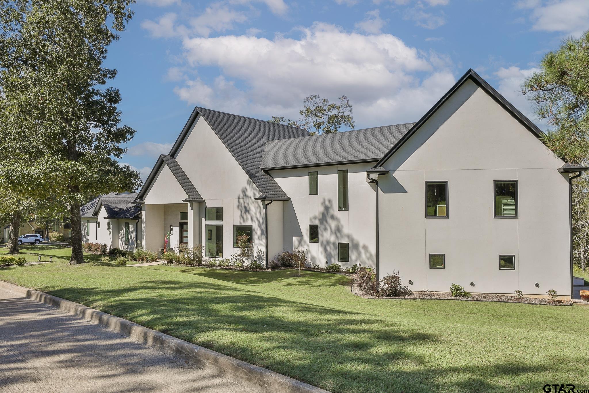 2854 J J.Cupit Court Tyler, TX 75709 - Photo 5 of 48 a view of a house with backyard