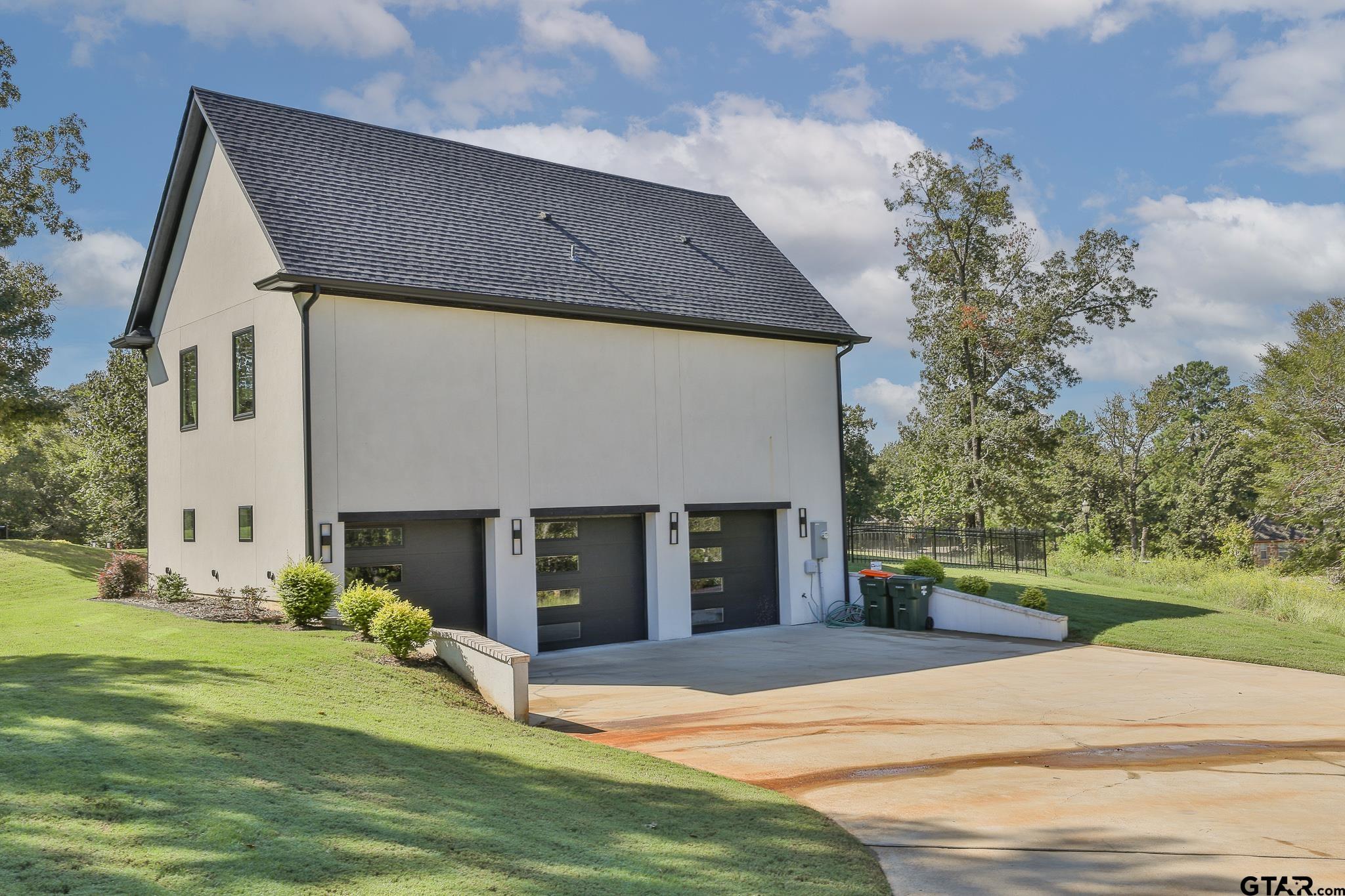 2854 J J.Cupit Court Tyler, TX 75709 - Photo 6 of 48 a front view of a house with a yard and garage