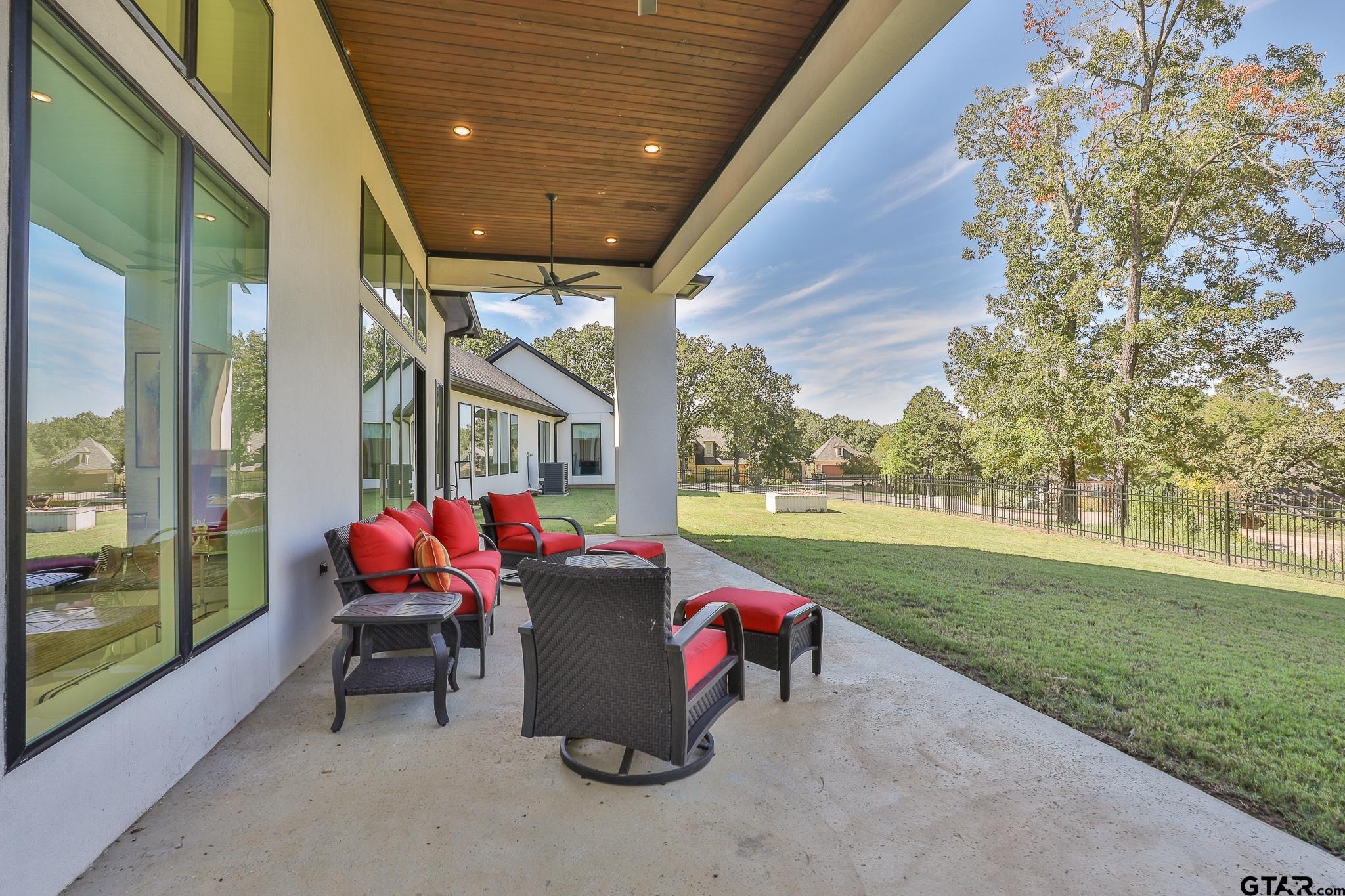 2854 J J.Cupit Court Tyler, TX 75709 - Photo 10 of 48 a view of a porch with furniture and a yard