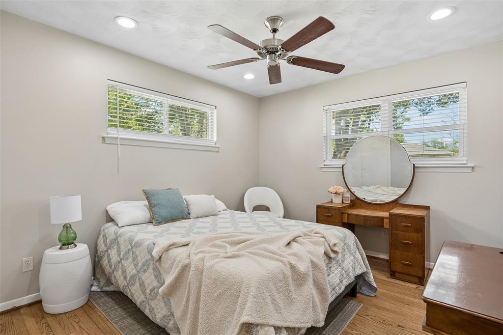 8049 Woodhue Road Dallas, TX 75228 - Photo 21 of 24 a bedroom with bed and a window