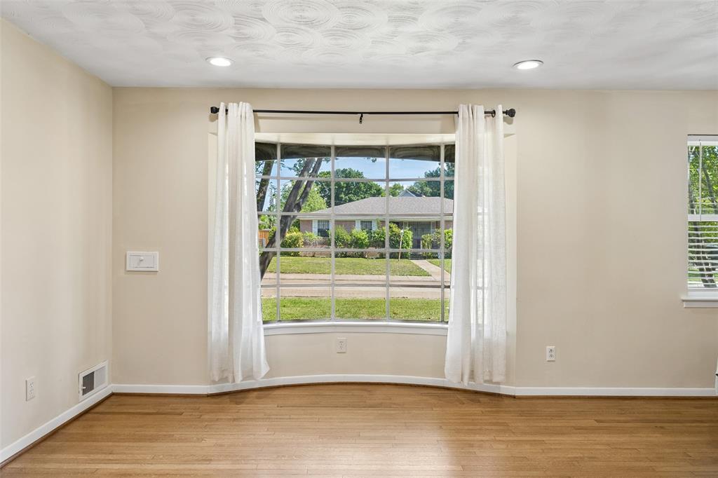 8049 Woodhue Road Dallas, TX 75228 - Photo 10 of 24 a view of wooden floor and brick walls