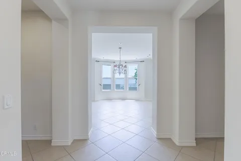 a view of a room with window and chandelier