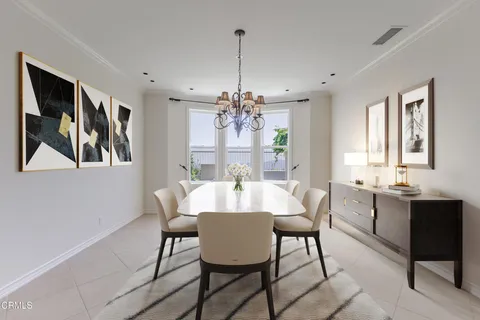 a kitchen with a sink and a refrigerator