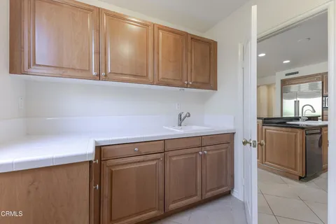 a bathroom with a toilet a sink a mirror a bathtub and vanity