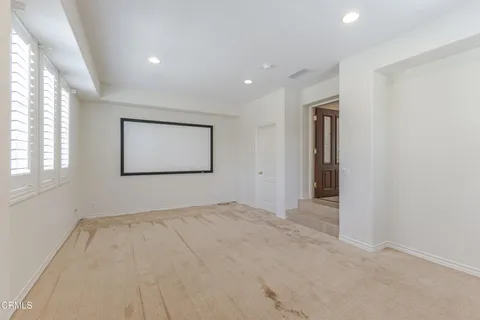 a living room with furniture and window