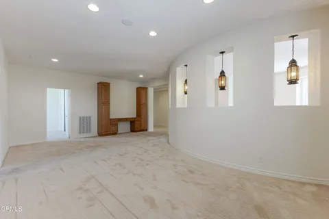 a spacious bathroom with a tub a sink and mirrors
