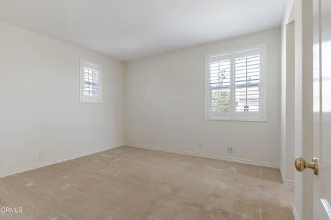 a bath tub sitting in a bathroom next to a window