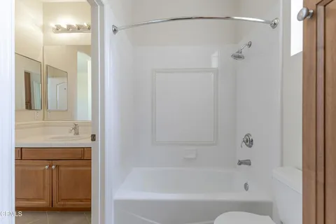 a view of a patio with table and chairs potted plants with wooden fence