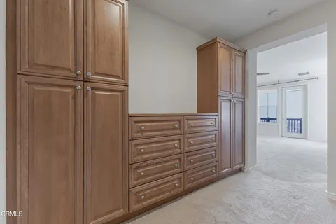 a front view of a house with a yard and a garden