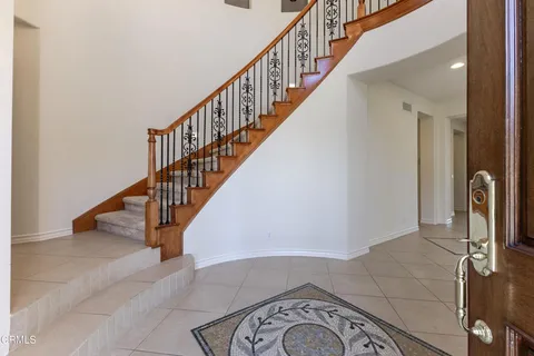 a view of a livingroom with an empty space and a fireplace