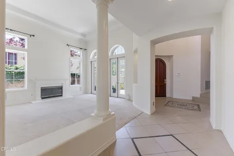 a view of livingroom with furniture flat screen tv and fireplace