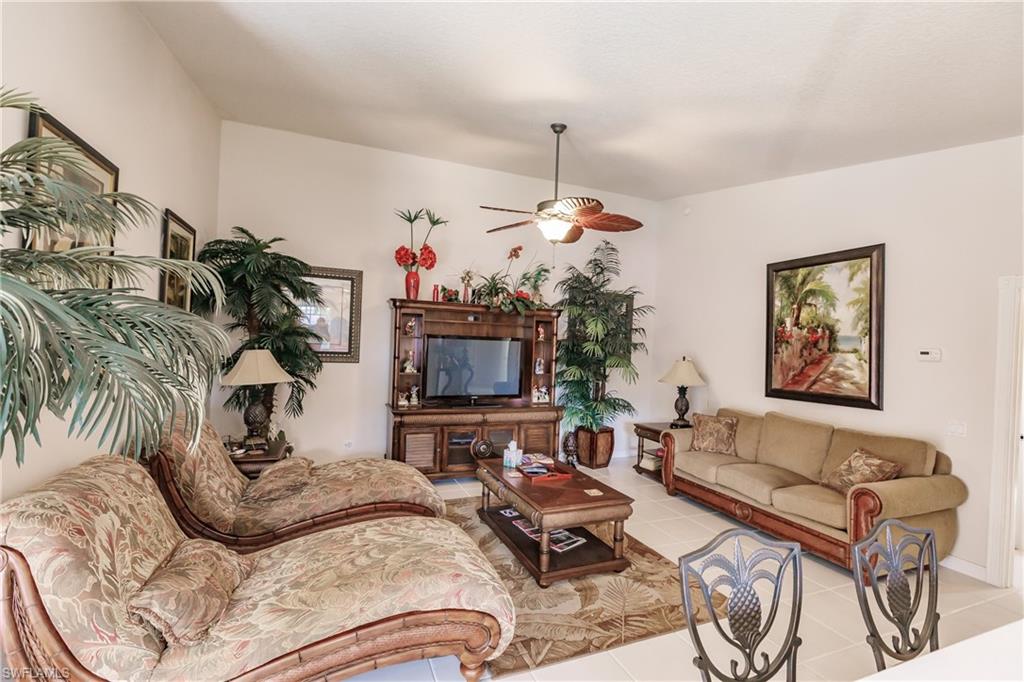 4113 Tabago Lane Naples, FL 34119 - Photo 20 of 50 Living room with ceiling fan and light tile patterned floors